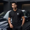 man-wearing-black-polo-t-shirt-standing-near-luxury-car-premium-fashion-look