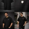 man wearing black oversized t-shirt with minimal logo modern streetwear style